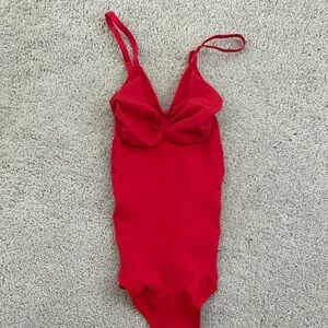 Red bodysuit, shape shifting